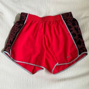 Nike Dri-fit XS pink shorts with navy and light blue/grey cheetah print on sides